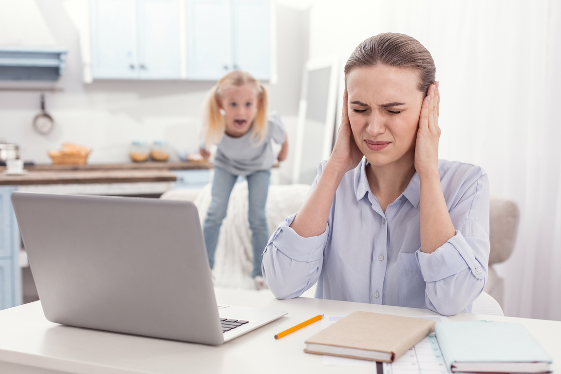 Stressful single mother obstructing from kids screaming